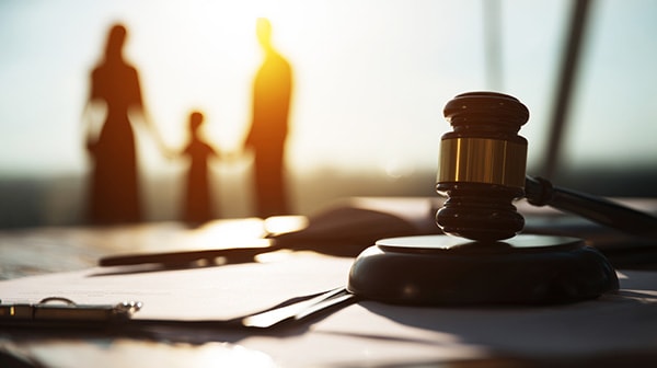 Judge's gavel and legal documents representing child support proceedings
