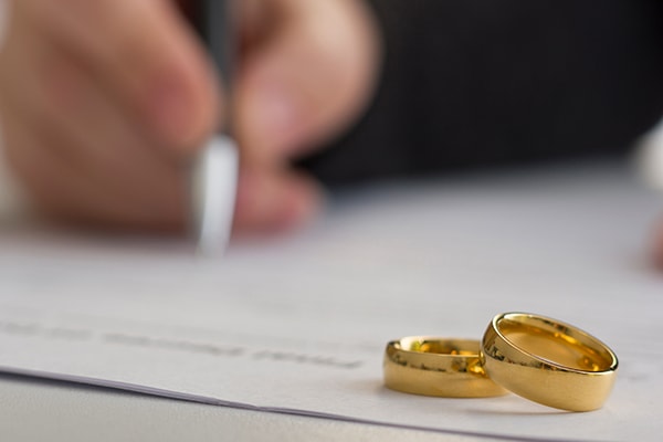 Wedding rings on a divorce document